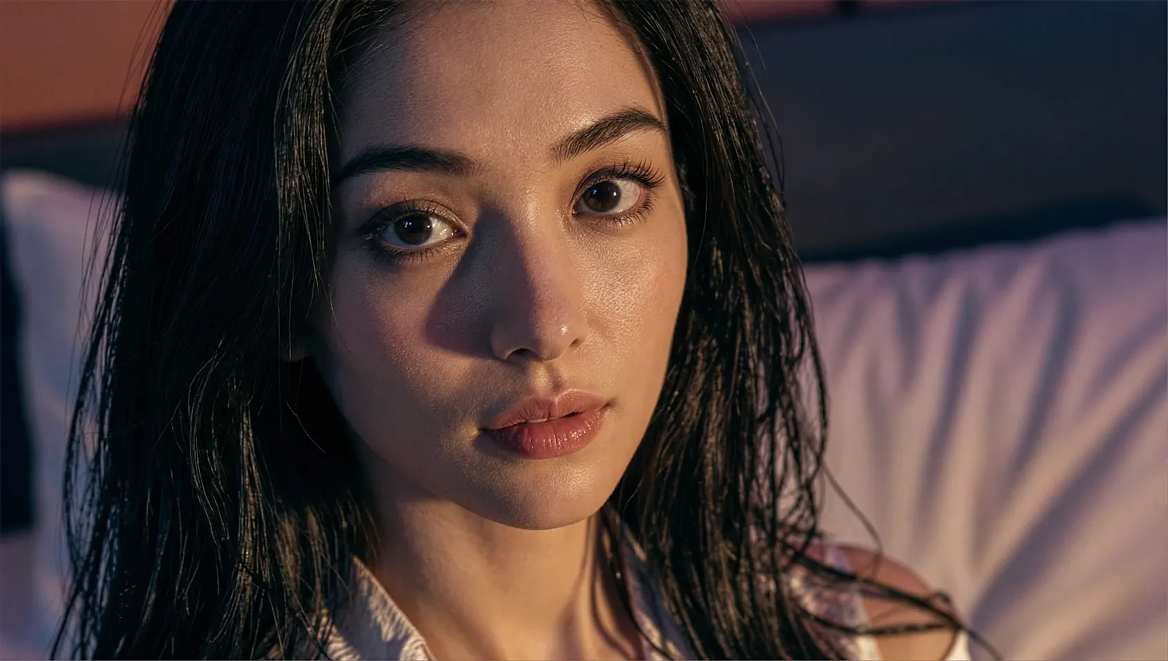 Close portrait of a fictional AI character against a dark background